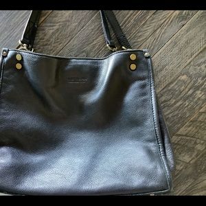 American Leather bag. Interior zip compartment with inside zip and two pockets.